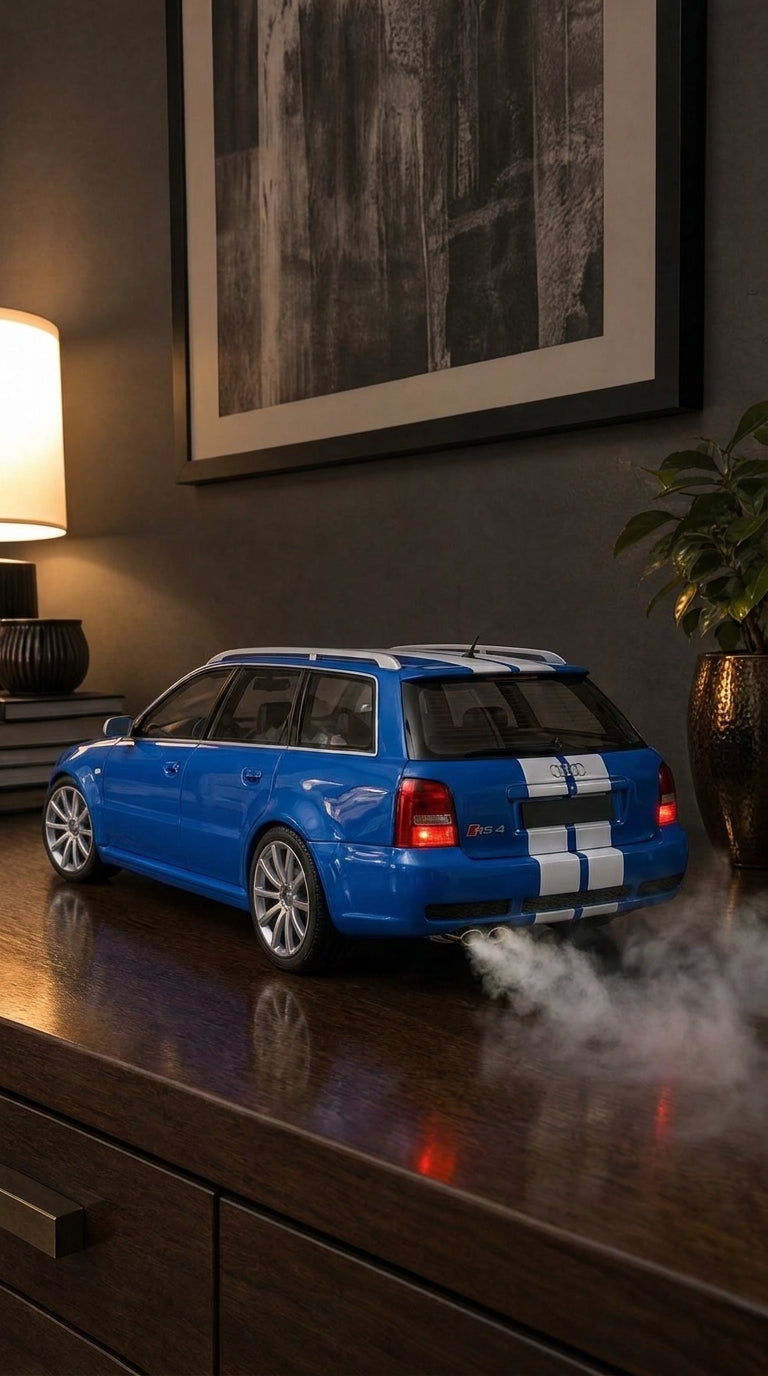 Blue Audi RS4 Avant estate model with white stripes and roof rails, smoke from the oval exhaust tips