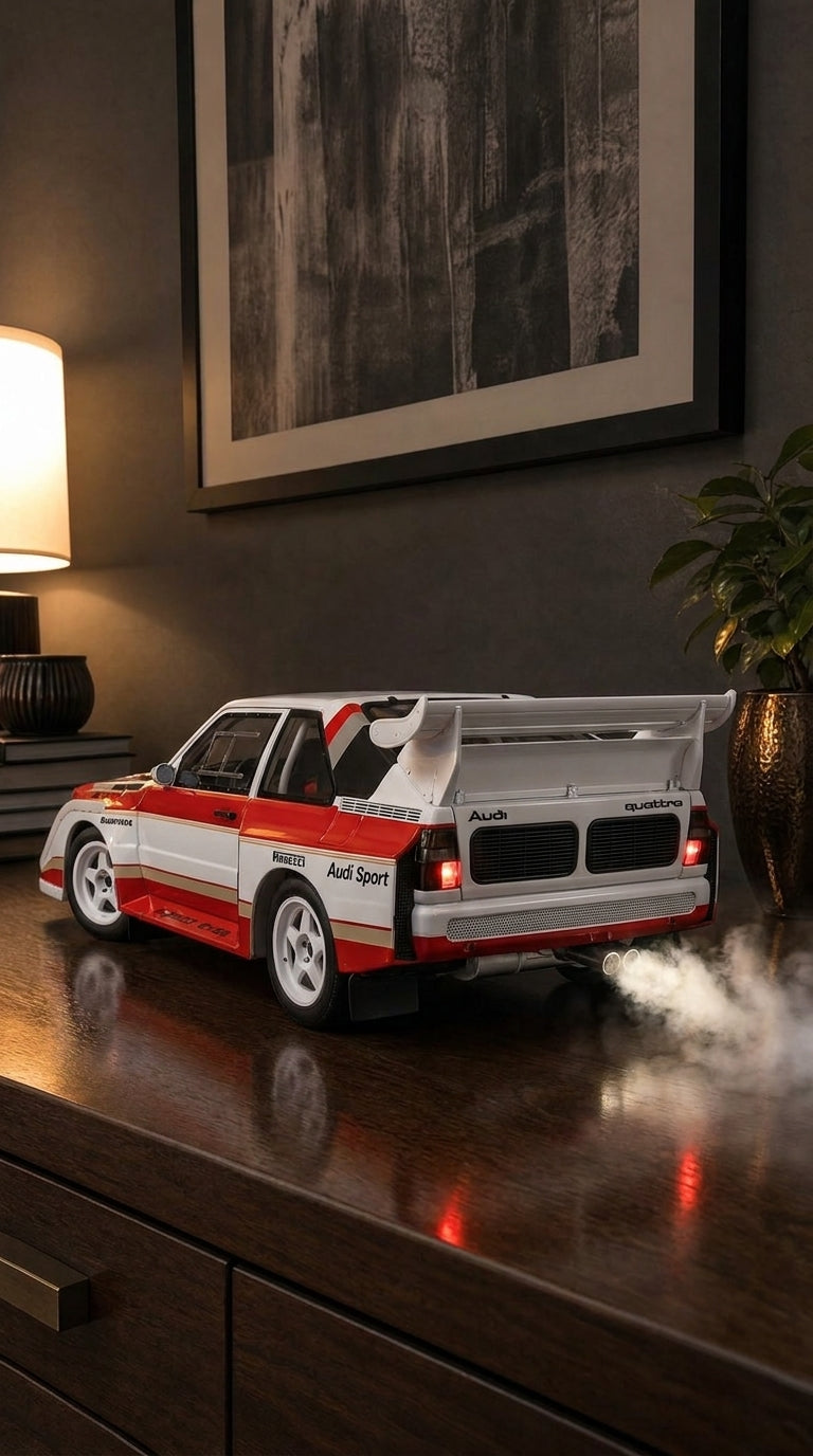 White Audi Quattro S1 rally car model with red stripes, huge rear wing and smoke from the twin exhaust