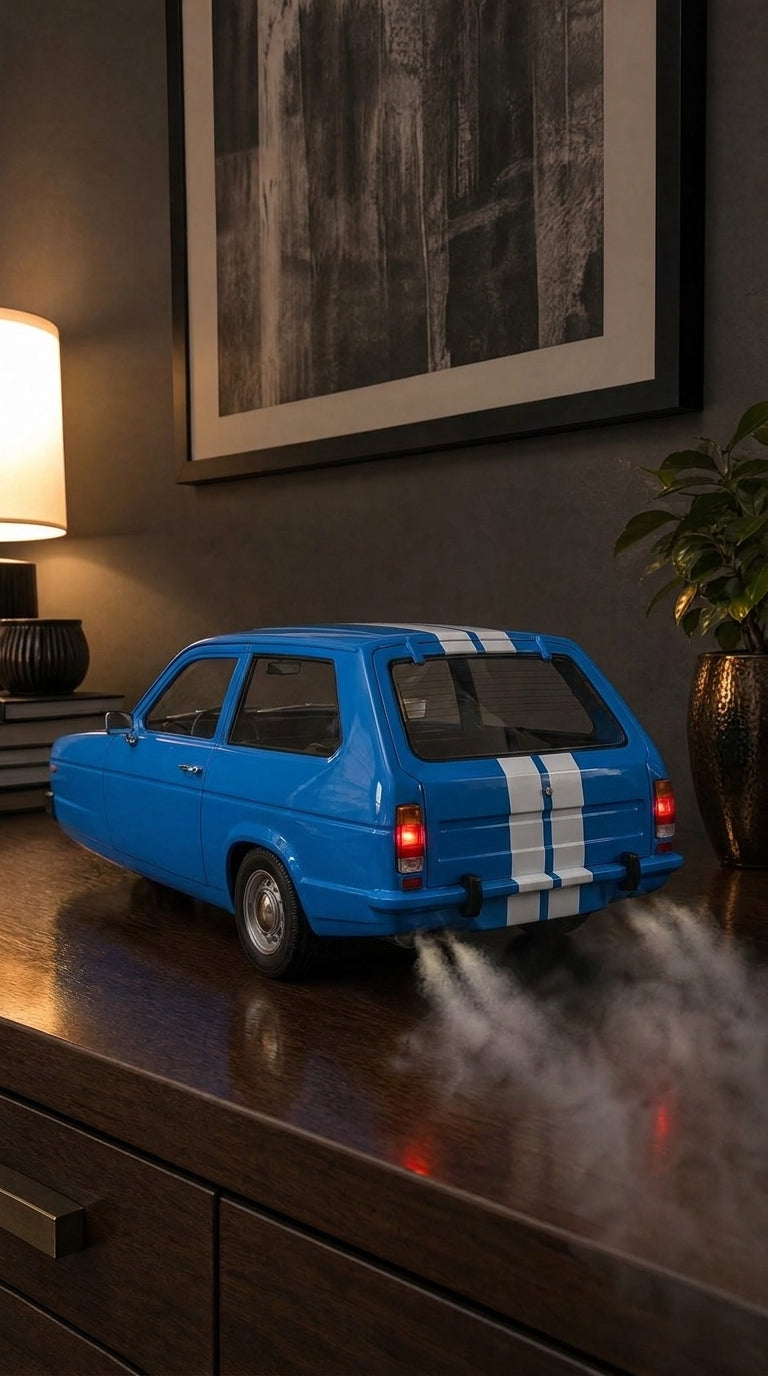 Blue Reliant Robin three-wheeler model with white stripes, tail lights on and smoke from the exhaust
