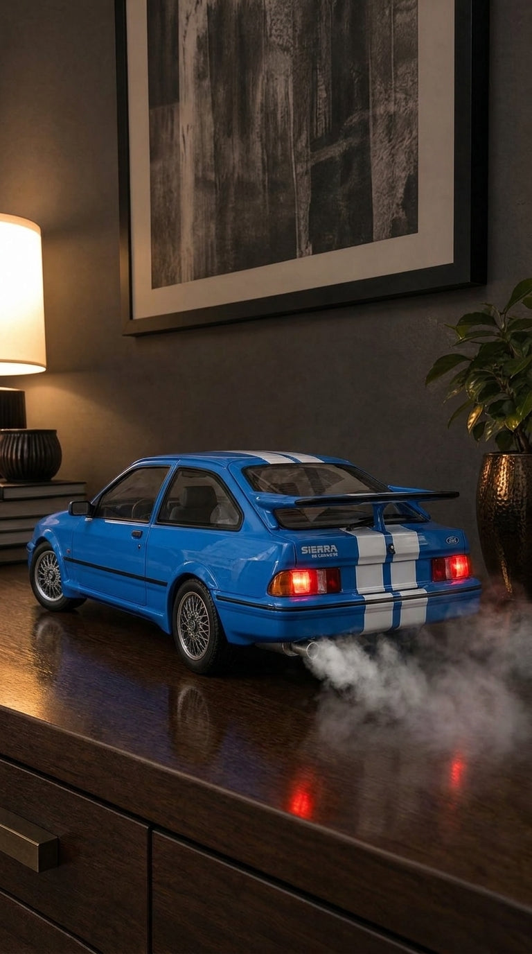 Blue Ford Sierra RS Cosworth model with white stripes and rear wing, tail lights on and smoke from the exhaust