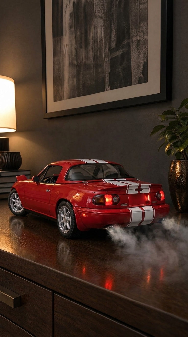 Red Mazda MX-5 NA roadster model with white stripes and hardtop, oval tail lights on and smoke from the exhaust
