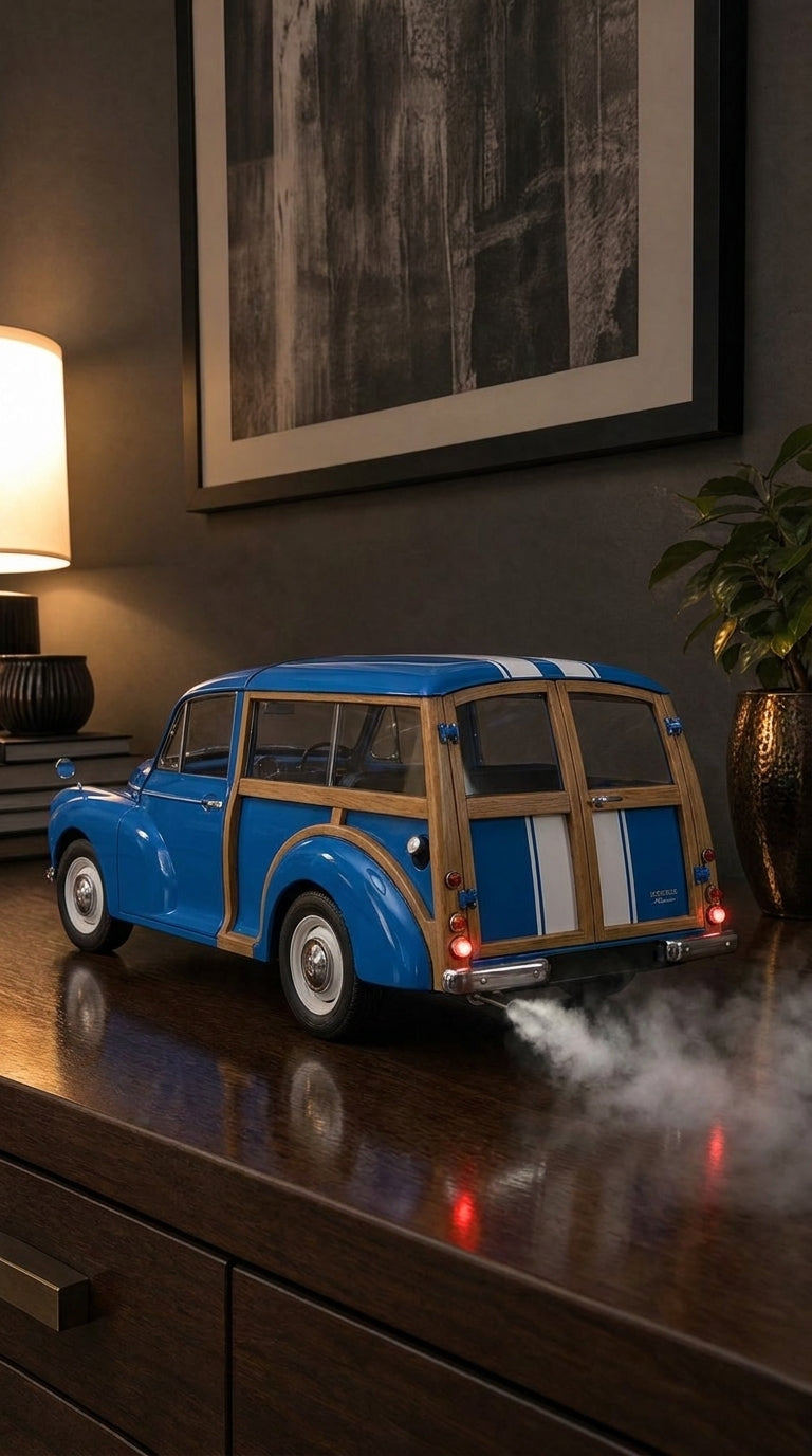 Blue Morris Minor Traveller model with wooden ash frame, chrome bumpers and whitewall tyres, smoke from the exhaust