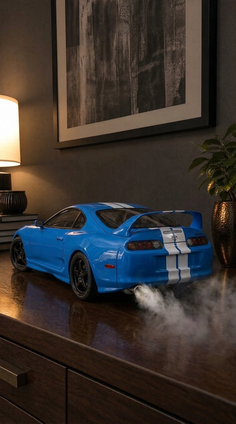 Blue Toyota Supra A80 model with white stripes and hoop rear wing, round tail lights on and smoke from the exhaust
