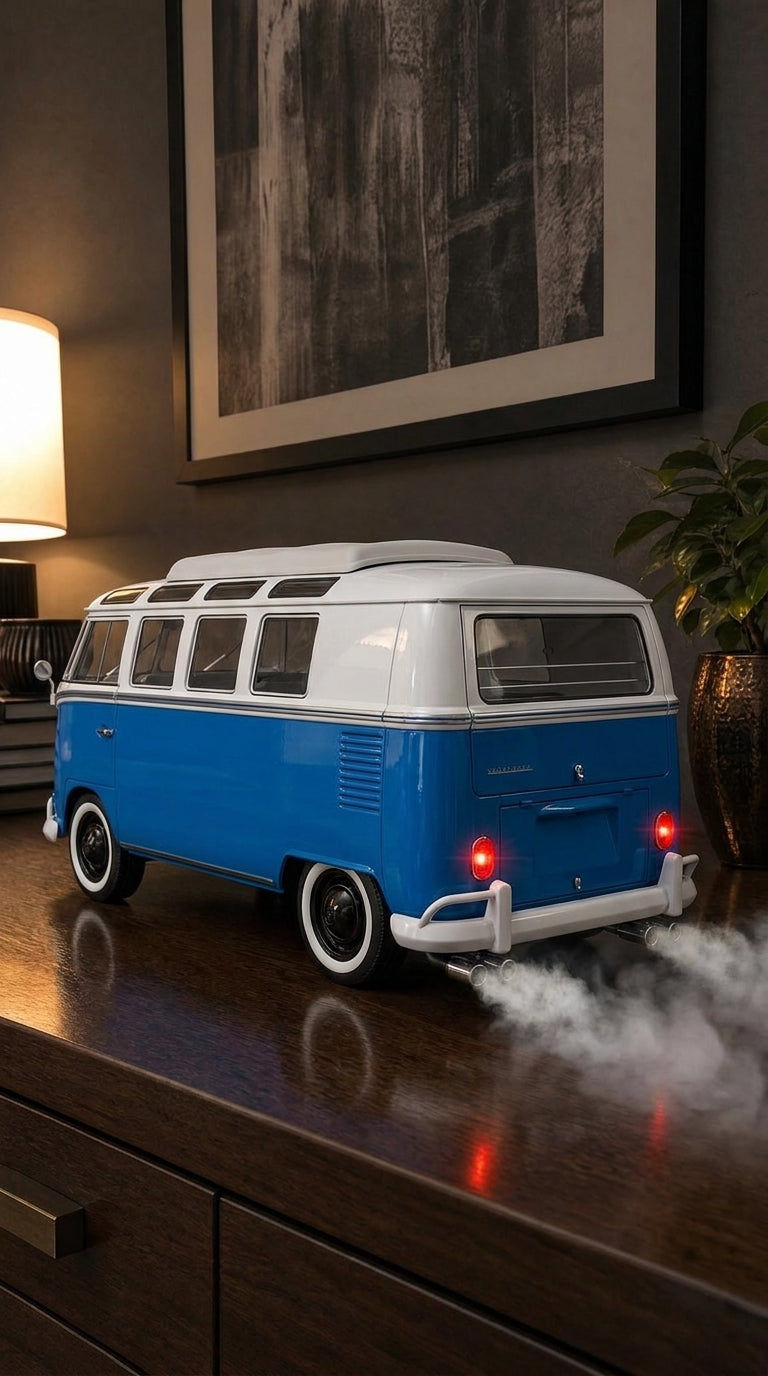 Blue and white Volkswagen Type 2 camper bus model with skylight windows and whitewall tyres, smoke from twin exhausts