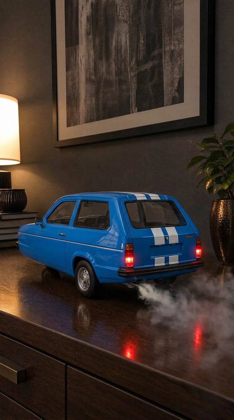 Blue Reliant Robin three-wheeler model from the rear quarter, tail lights on and smoke drifting across the dresser