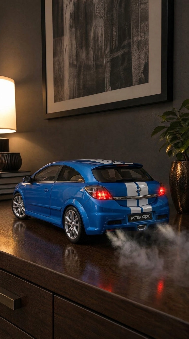 Blue Opel Astra OPC hatchback model with white stripes and roof spoiler, smoke from the centre exhaust