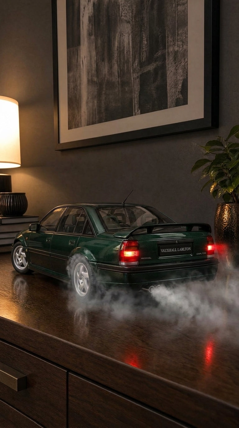 Dark green Vauxhall Lotus Carlton saloon model with boot spoiler and five-spoke wheels, smoke from the twin exhaust