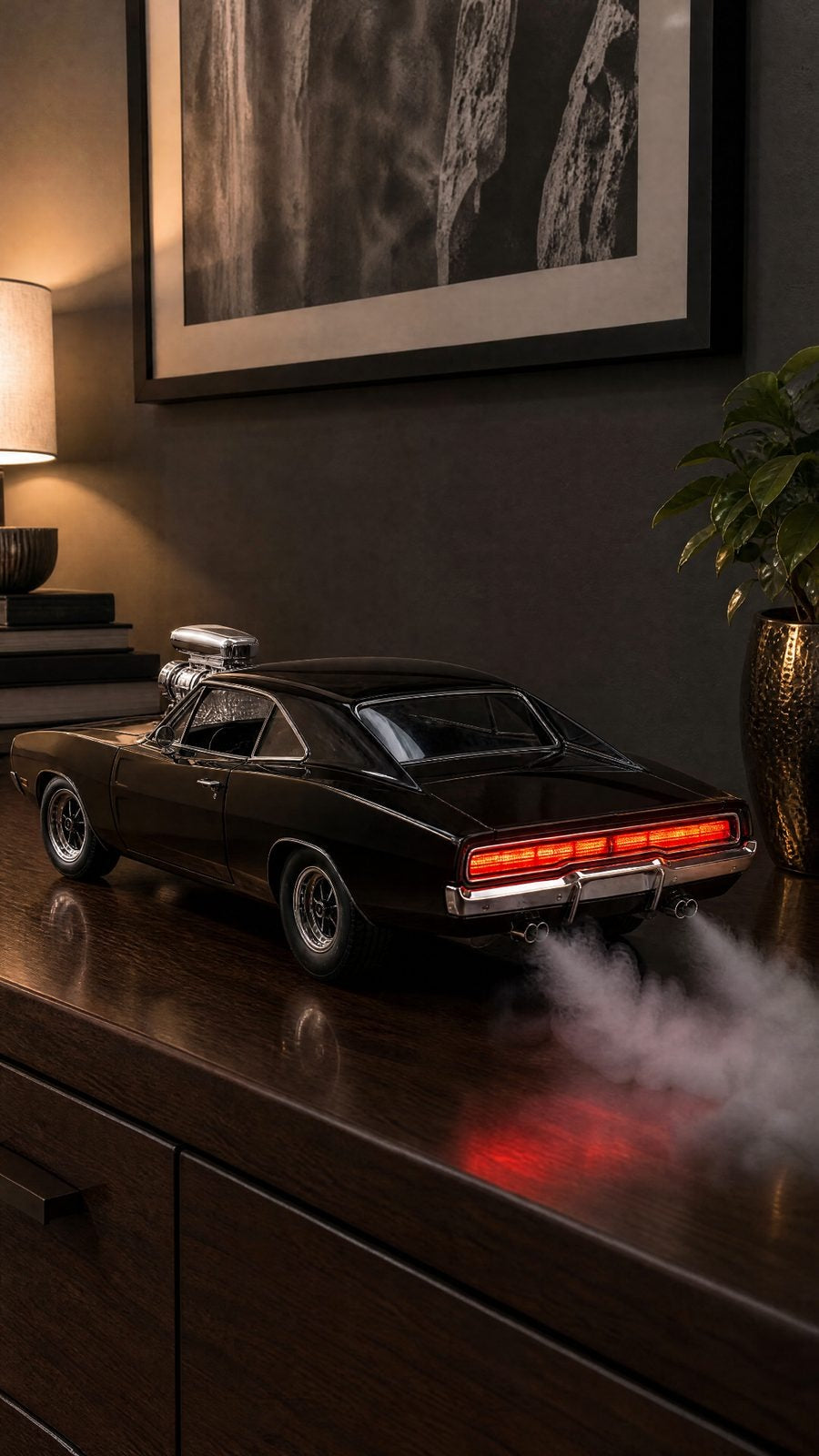 Gloss black '70 Charger model with chrome supercharger, full-width red tail lights and smoke from twin exhausts