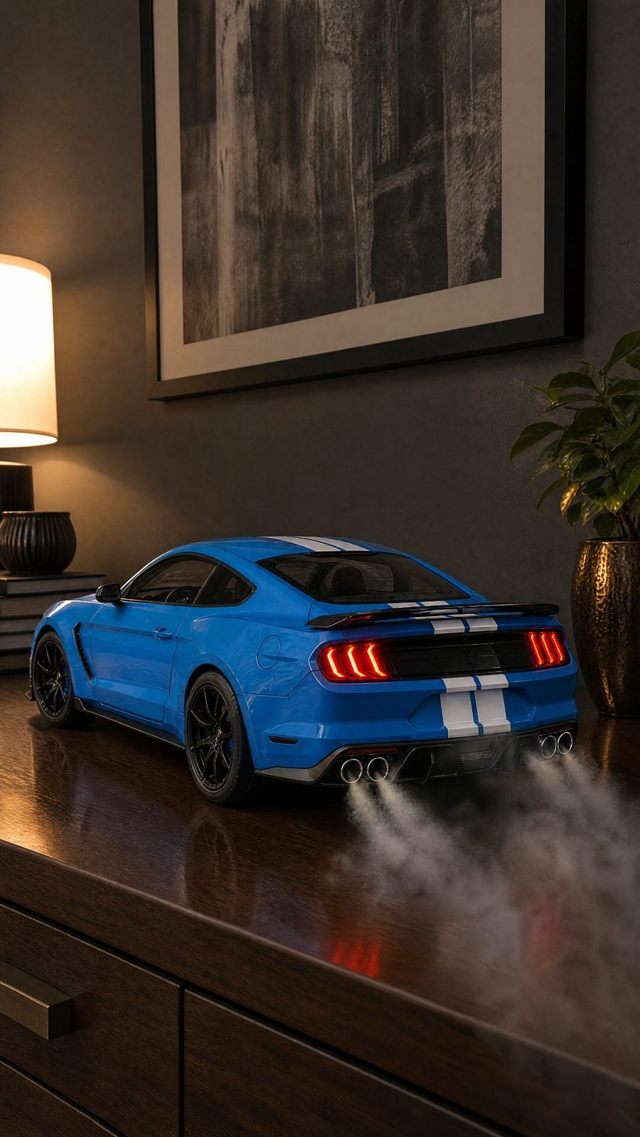 Blue Mustang GT350 model with white racing stripes, tri-bar tail lights and smoke from quad exhausts